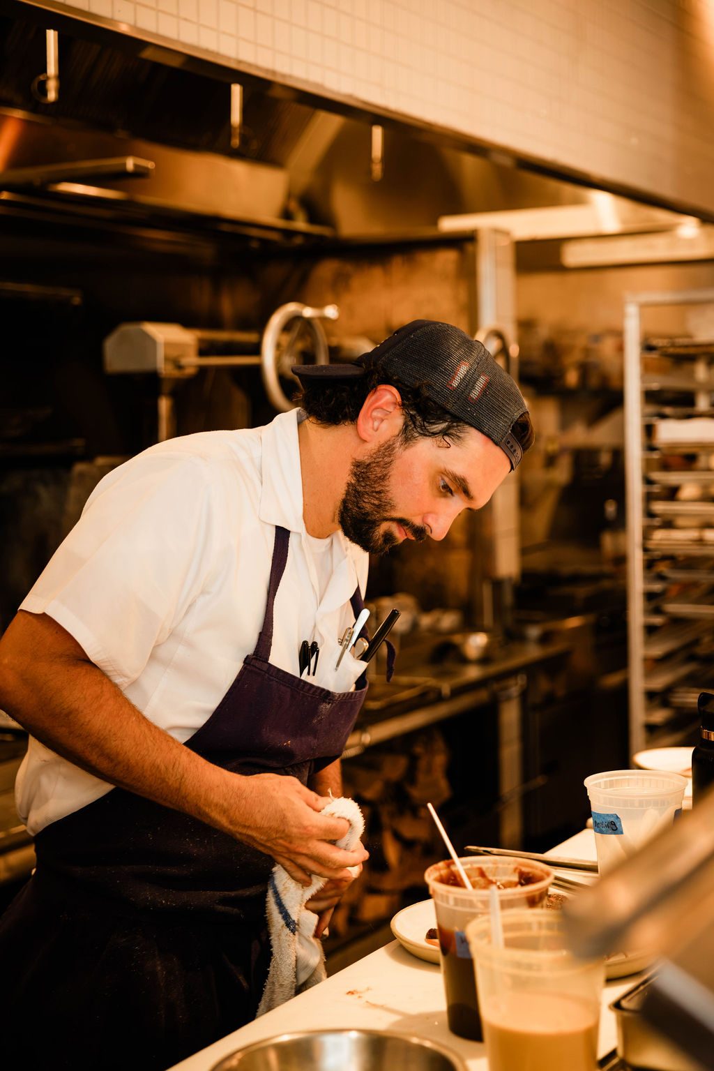 A chef plating at the pass